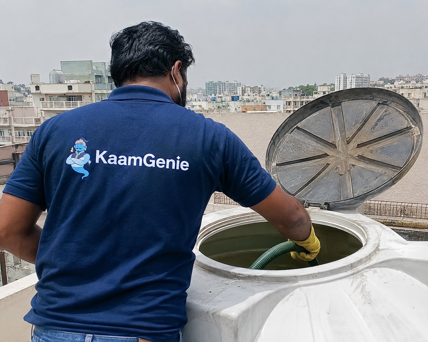 KaamGenie crew cleaning a rooftop water tank in Delhi