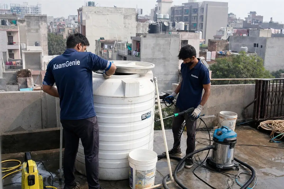 KaamGenie crew cleaning a water tank in Bhajanpura, Delhi