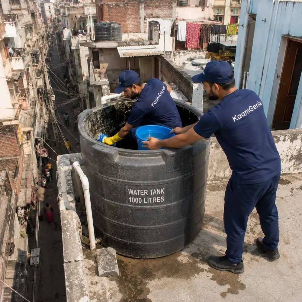 KaamGenie crew cleaning a water tank in Brahampuri, East Delhi