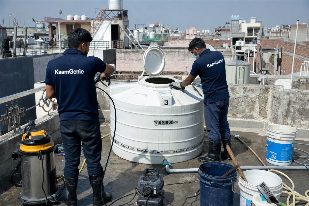 KaamGenie crew cleaning a water tank in Dashrath Puri, Delhi