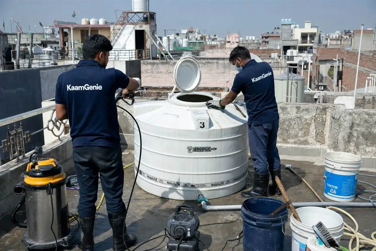 KaamGenie crew cleaning a water tank in Dashrath Puri, Delhi