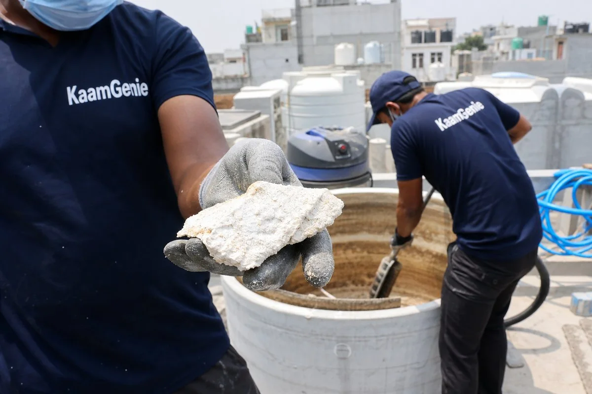 Mineral scale flake removed from a water tank in a hard-water area of Delhi