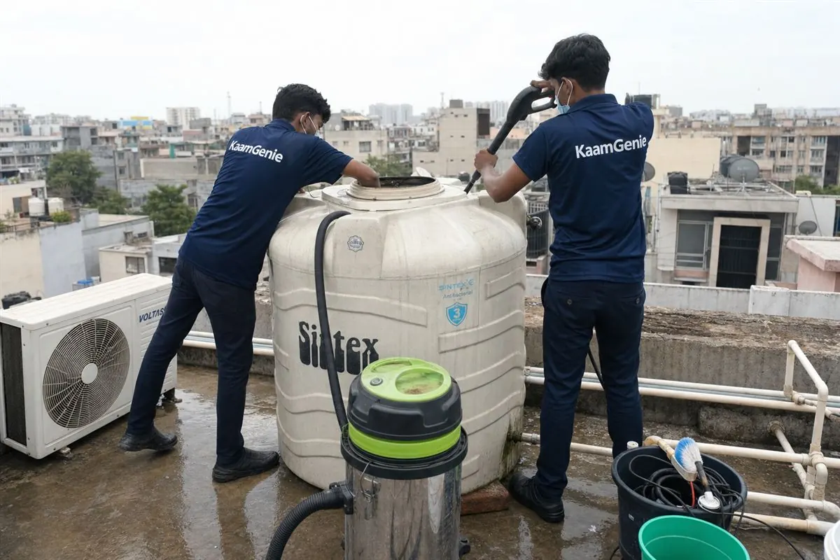 KaamGenie crew cleaning a water tank in Dwarka Mor, Delhi