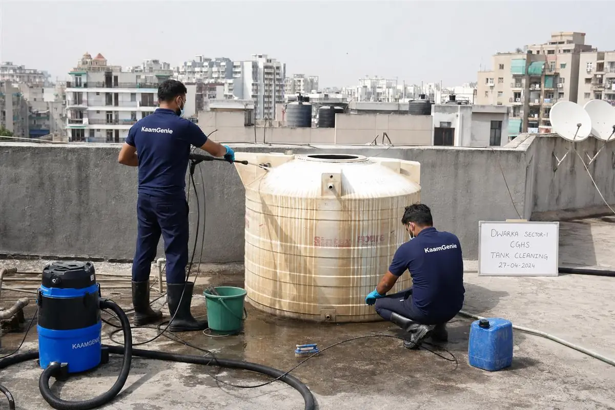 KaamGenie crew cleaning a water tank in Dwarka Sector 1, Delhi