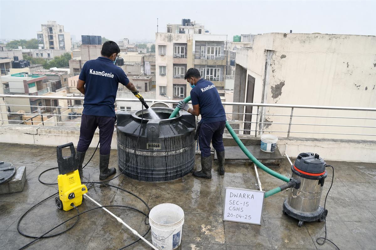 KaamGenie crew cleaning a water tank in Dwarka Sector 15, Delhi