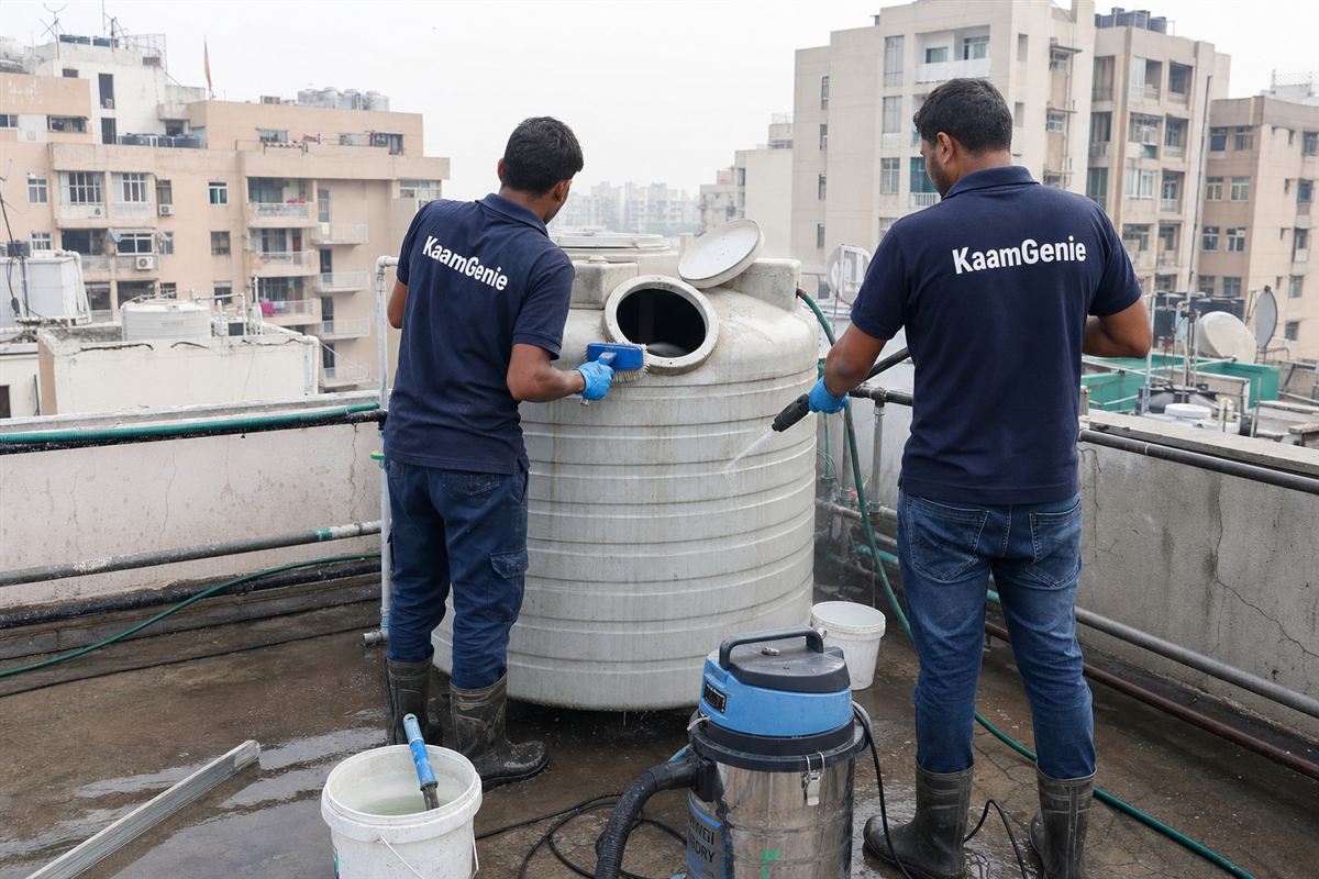 KaamGenie crew cleaning a water tank in Dwarka Sector 16, Delhi