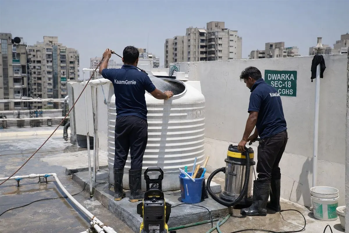 KaamGenie crew cleaning a water tank in Dwarka Sector 18, Delhi