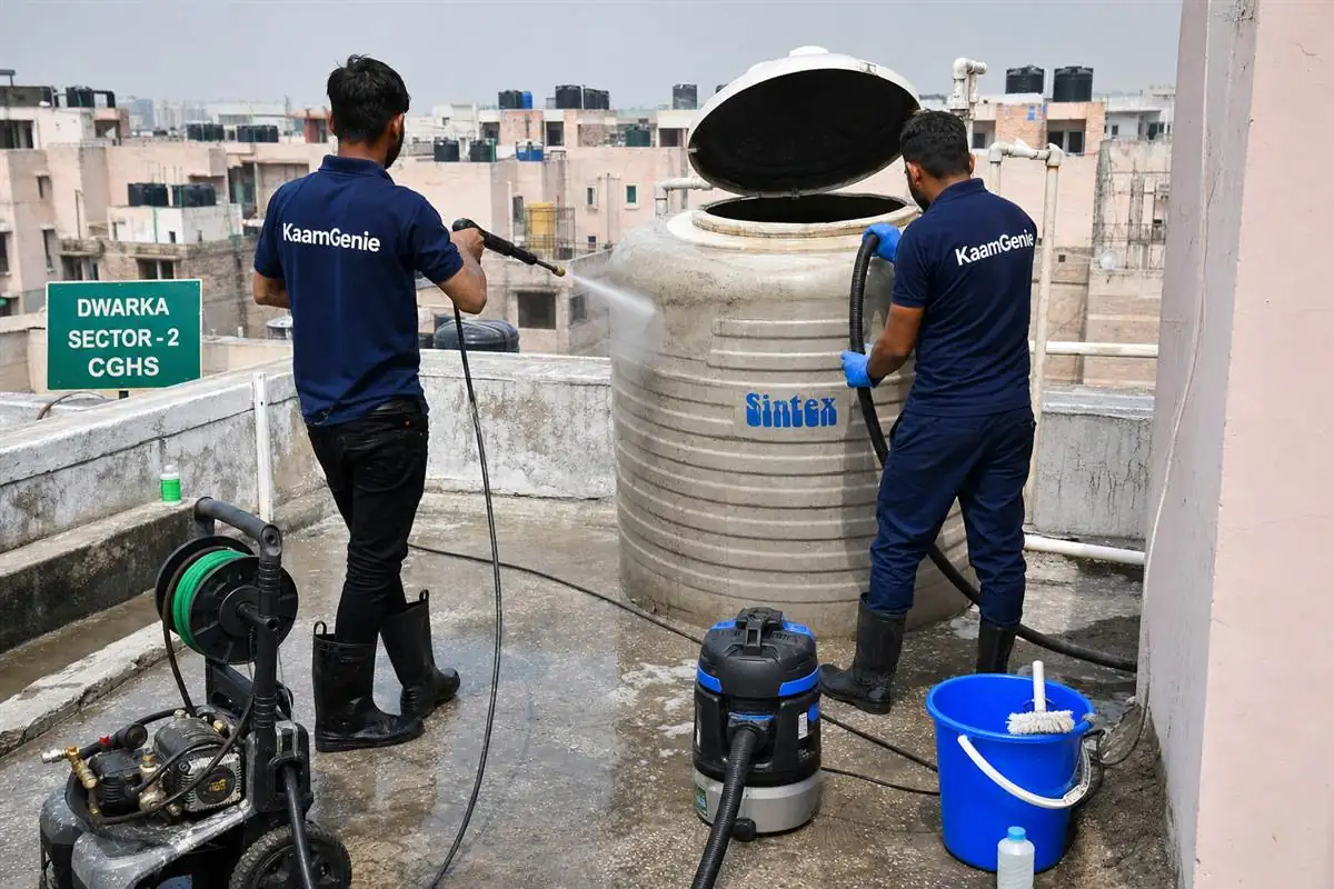 KaamGenie crew cleaning a water tank in Dwarka Sector 2, Delhi