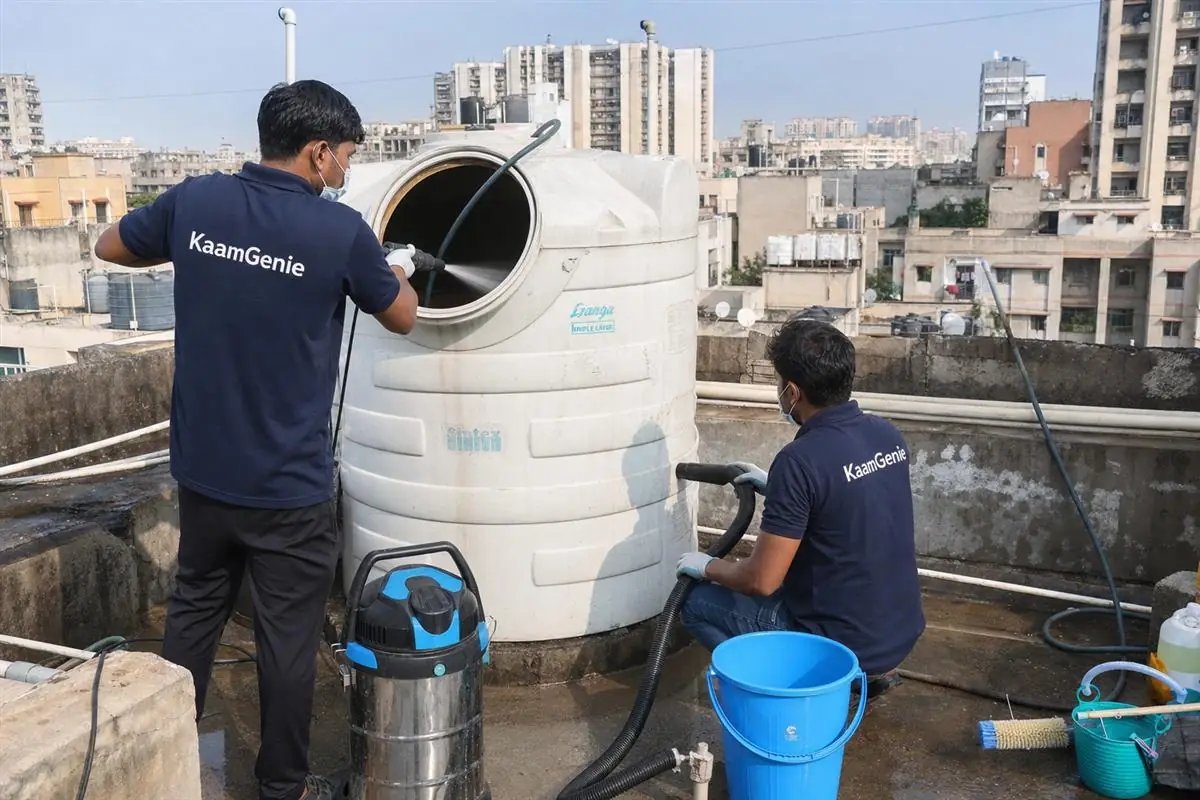 KaamGenie crew cleaning a water tank in Dwarka Sector 24, Delhi