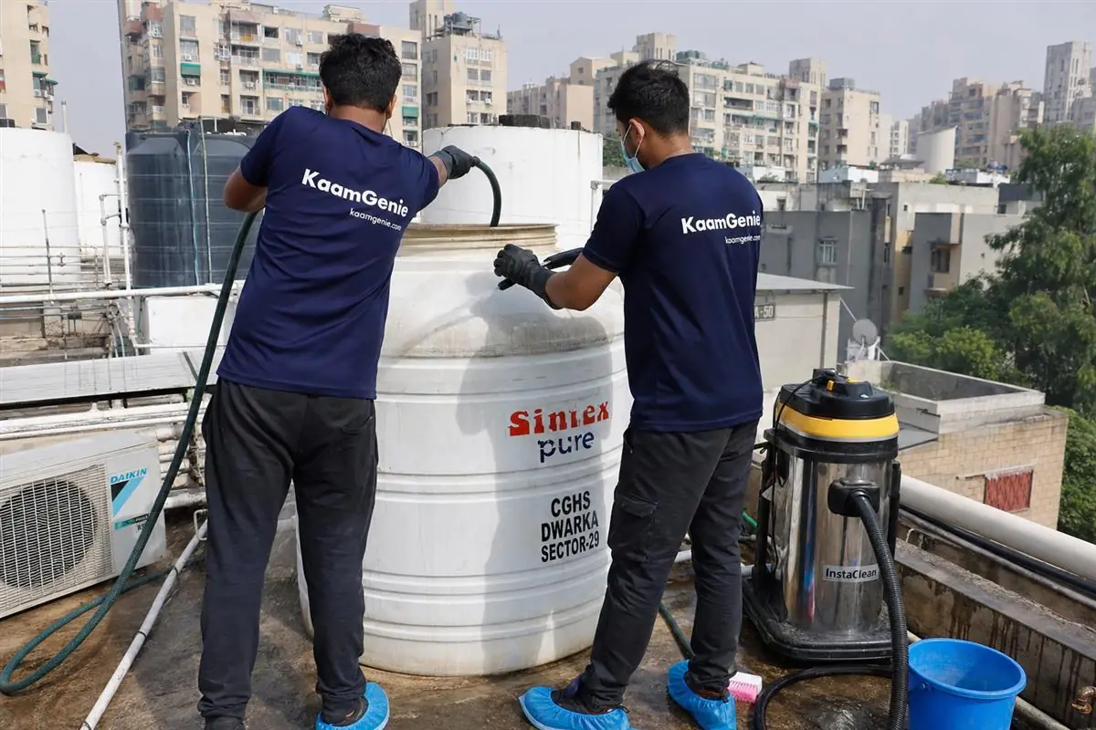 KaamGenie crew cleaning a water tank in Dwarka Sector 29, Delhi