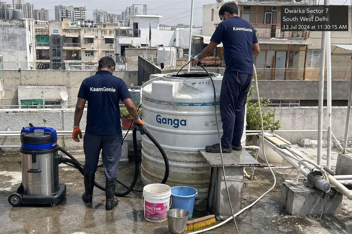 KaamGenie crew cleaning a water tank in Dwarka Sector 7, Delhi