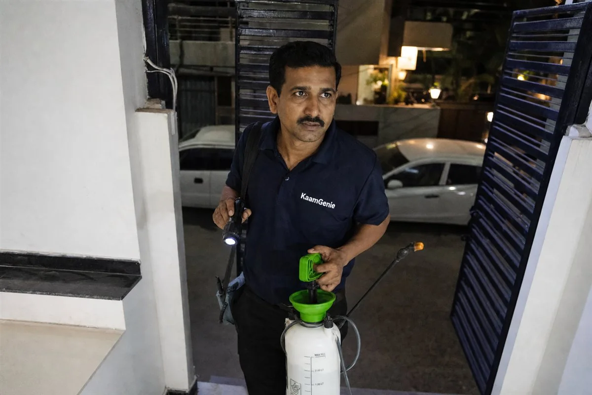 KaamGenie pest control technician arriving at a Delhi home with an emergency service kit to handle a sudden infestation