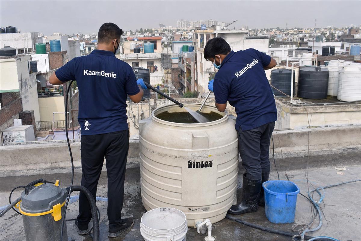 KaamGenie crew cleaning a water tank in Ajronda, Faridabad