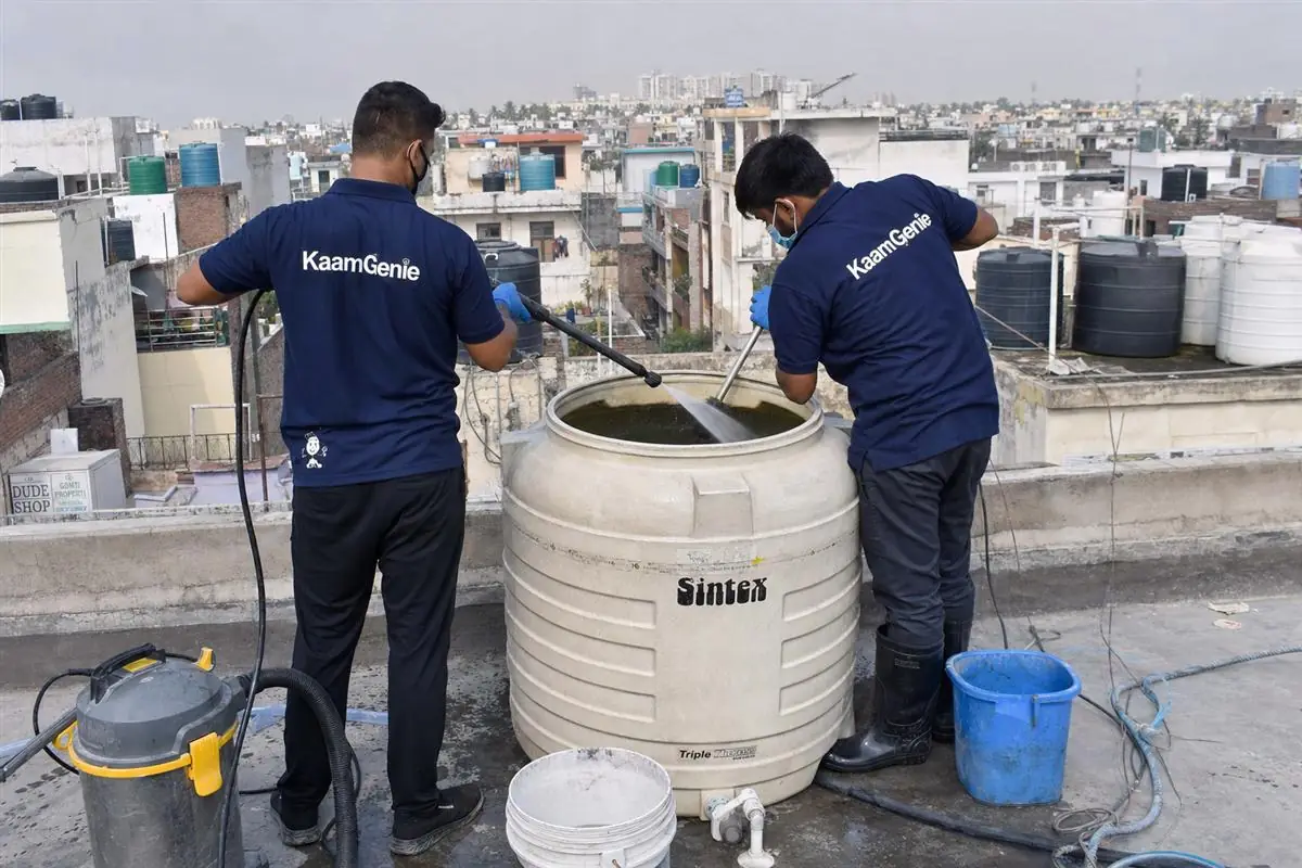 KaamGenie crew cleaning a water tank in Ajronda, Faridabad