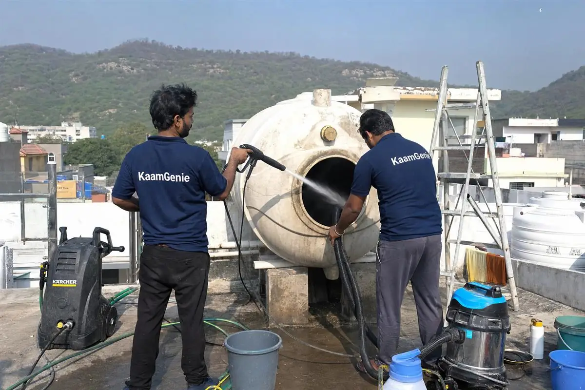 KaamGenie crew cleaning a water tank in Badkhal, Faridabad