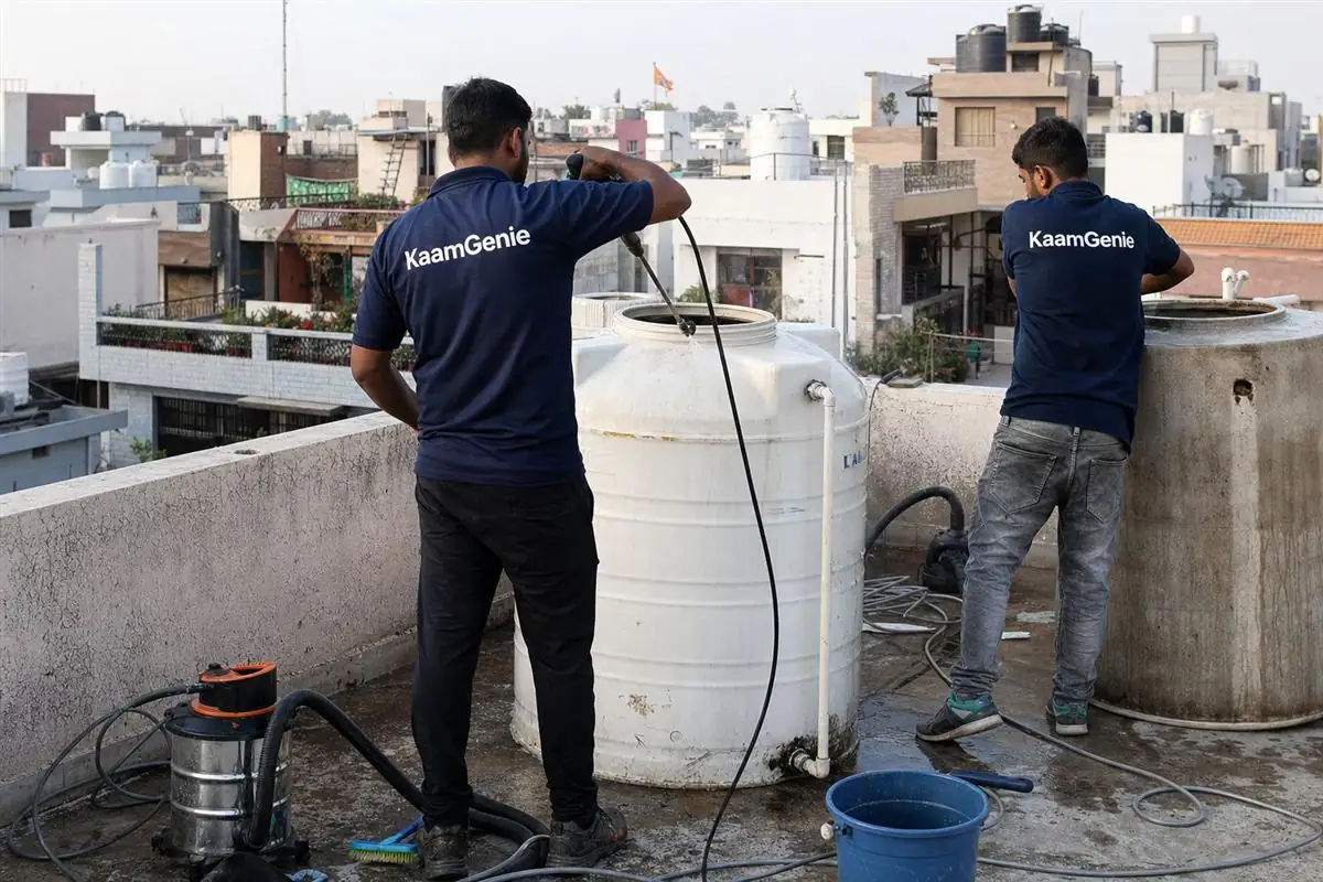 KaamGenie crew cleaning a water tank in Green Field Colony, Faridabad