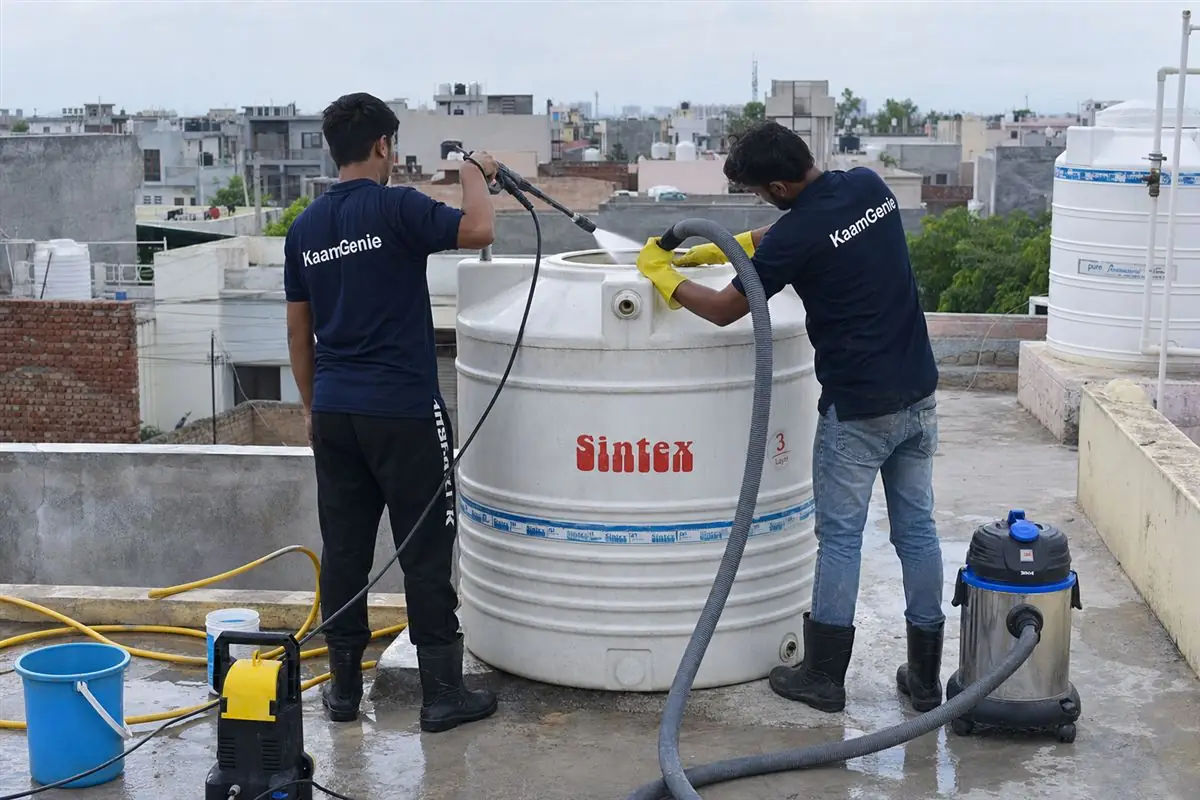 KaamGenie crew cleaning a water tank in Gurukul Basti, Faridabad
