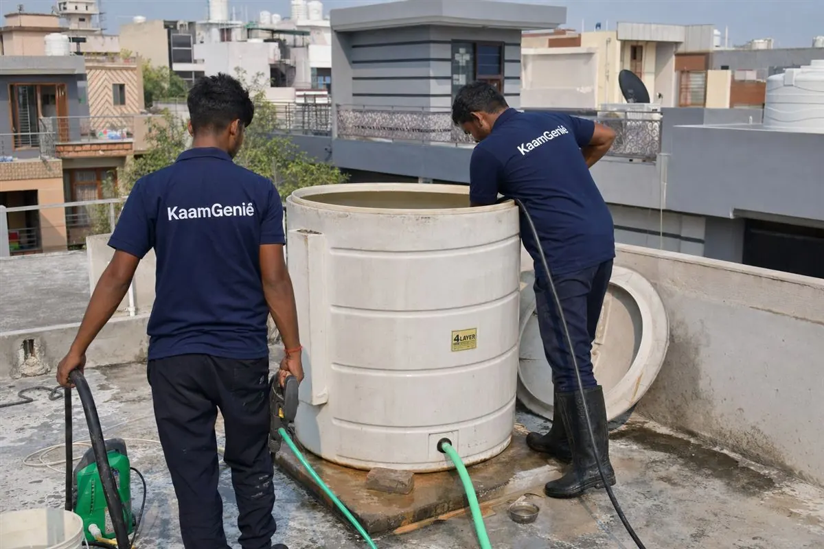KaamGenie crew cleaning a water tank in Indraprastha Colony, Faridabad