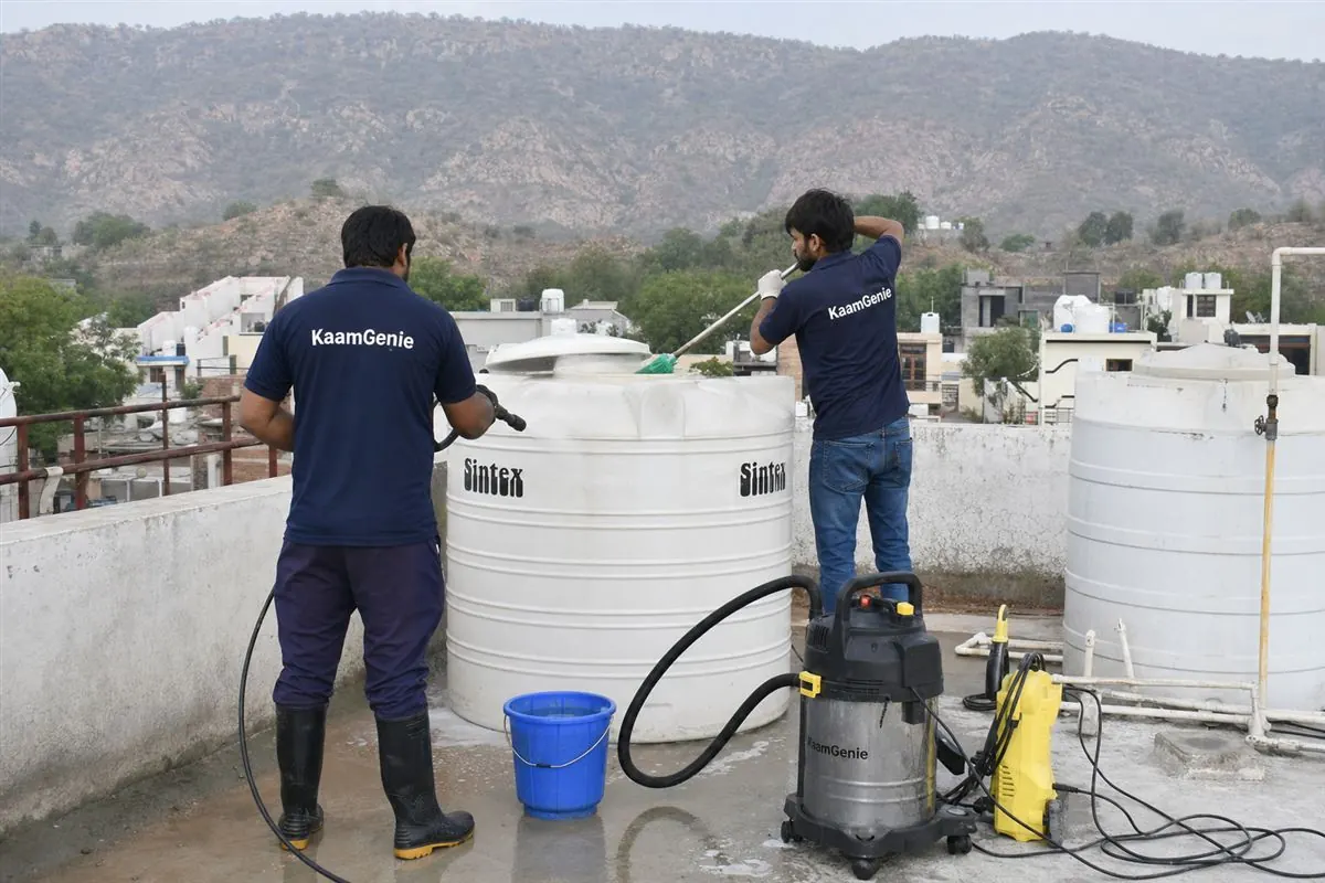 KaamGenie crew cleaning a water tank in Lakarpur, Faridabad
