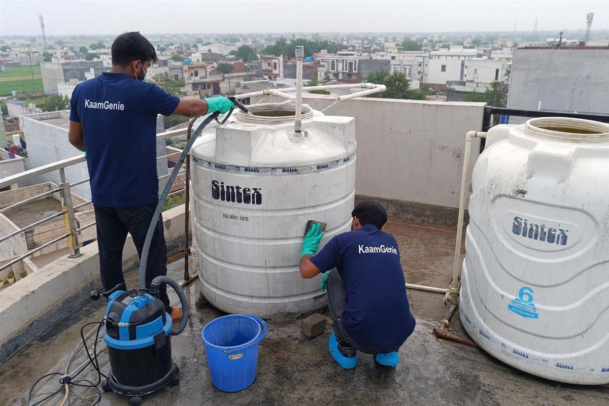 KaamGenie crew cleaning a water tank in Mohna, Faridabad