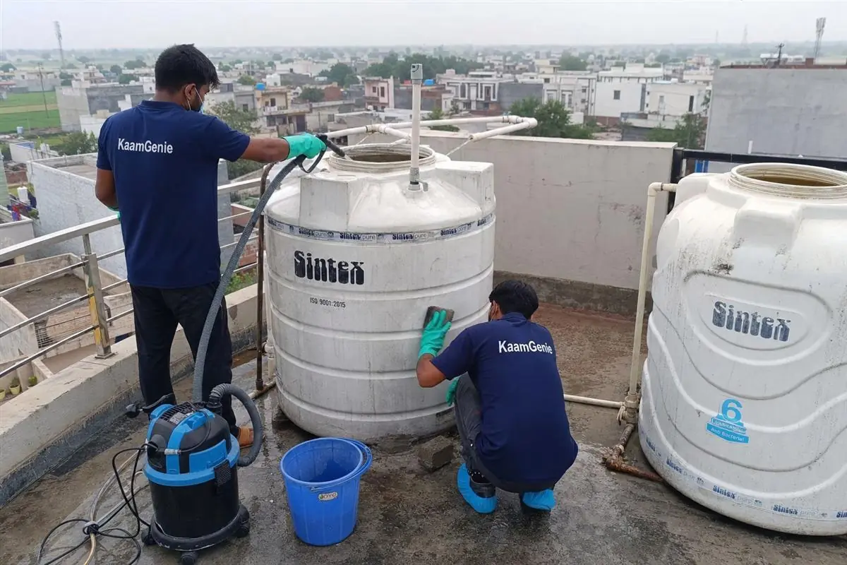 KaamGenie crew cleaning a water tank in Mohna, Faridabad