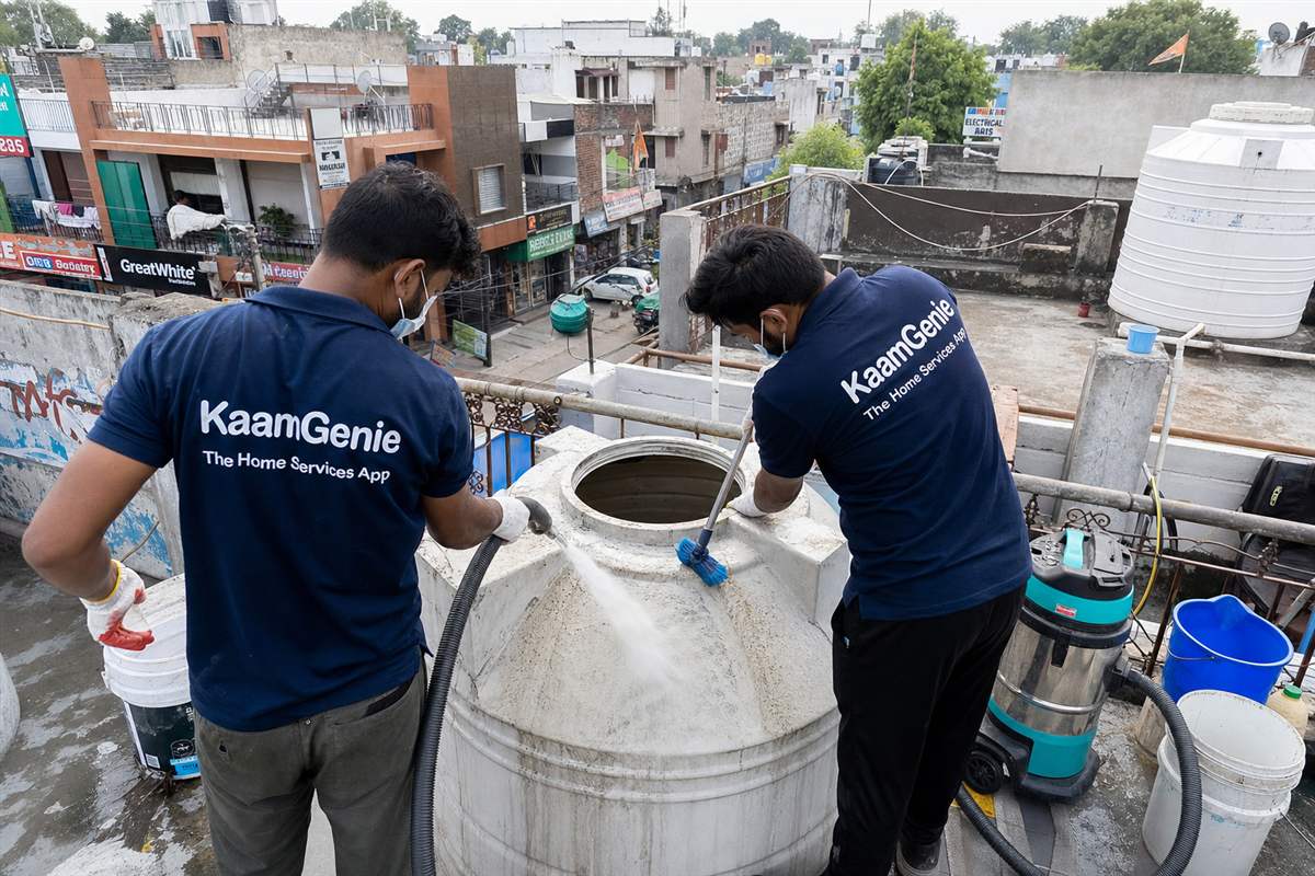 KaamGenie crew cleaning a water tank in NIT 5, Faridabad