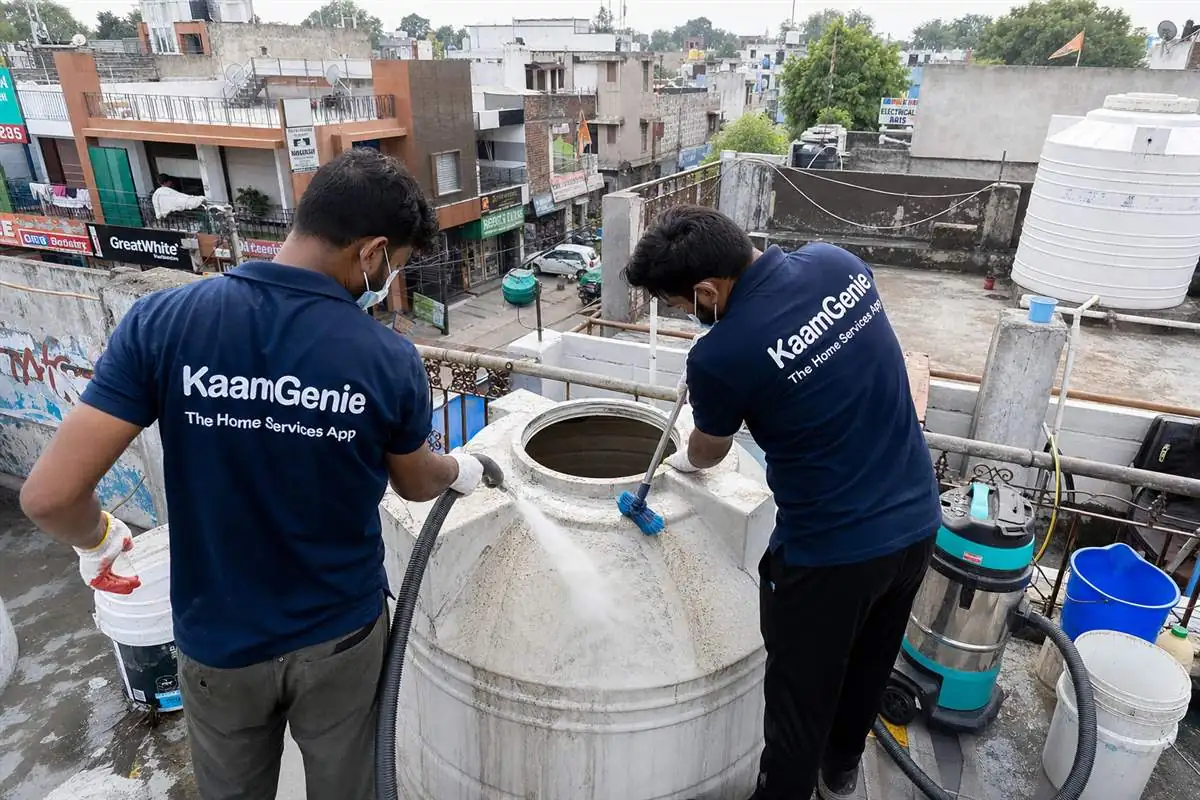 KaamGenie crew cleaning a water tank in NIT 5, Faridabad