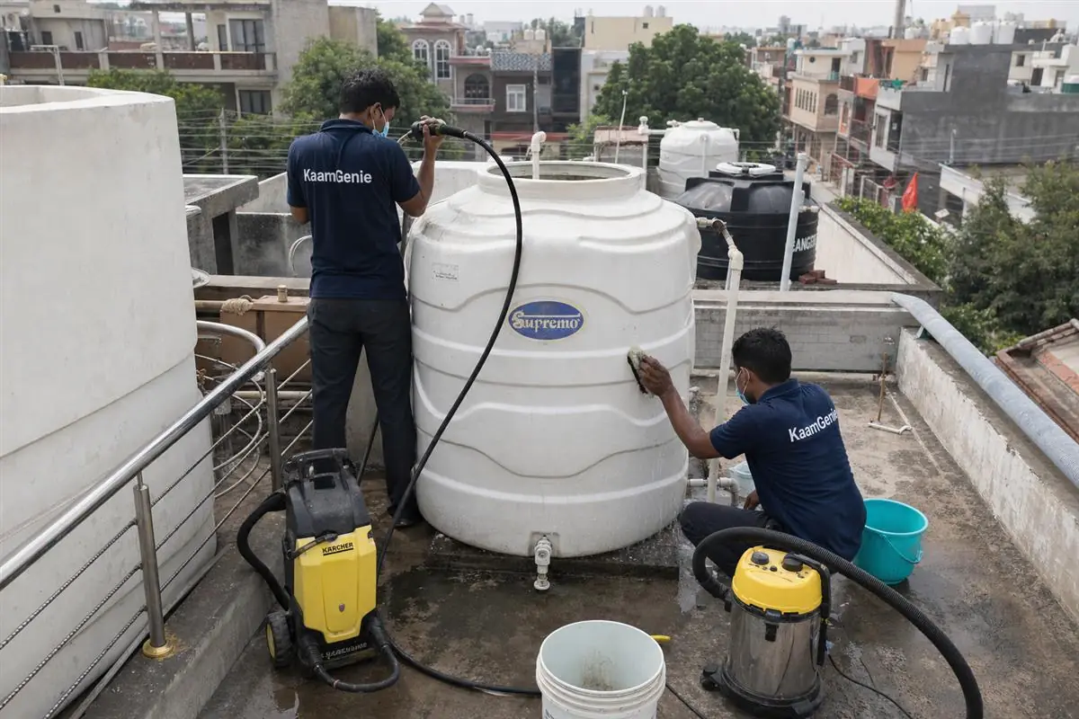 KaamGenie crew cleaning a water tank in Sainik Colony, Faridabad
