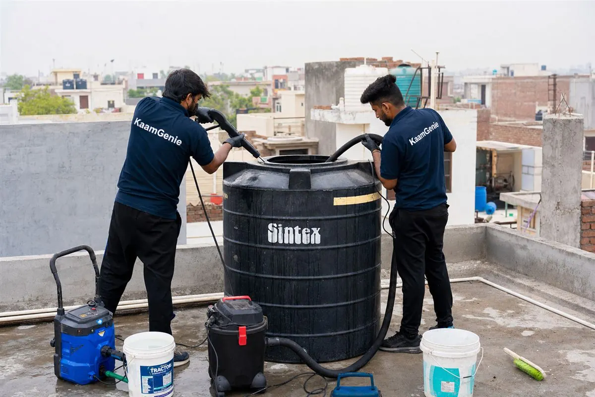 KaamGenie crew cleaning a water tank in Sarai Khwaja, Faridabad