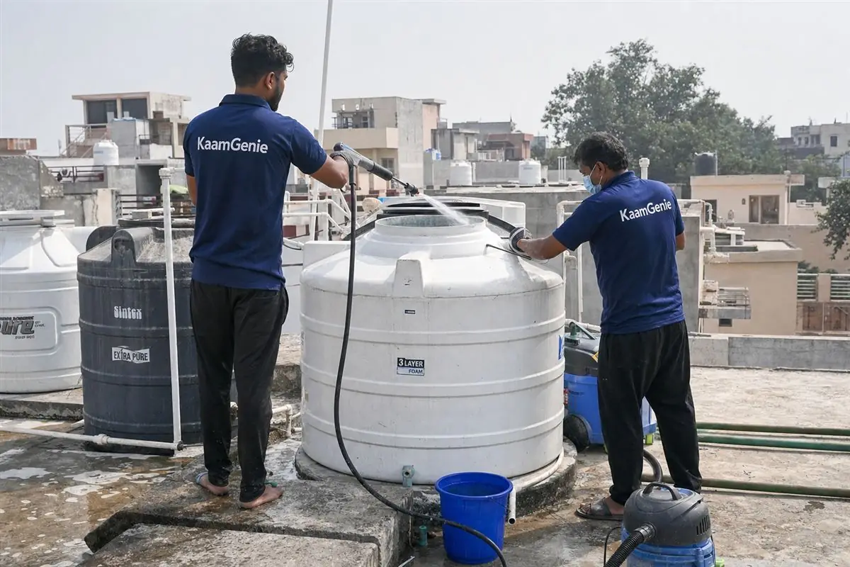 KaamGenie crew cleaning a water tank in Saran, Faridabad