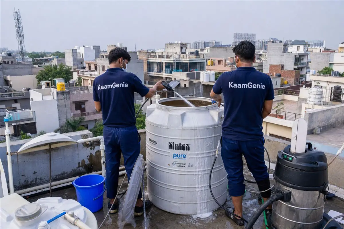 KaamGenie crew cleaning a water tank in Sector 10, Faridabad