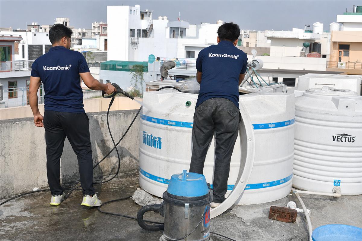 KaamGenie crew cleaning a water tank in Sector 11, Faridabad