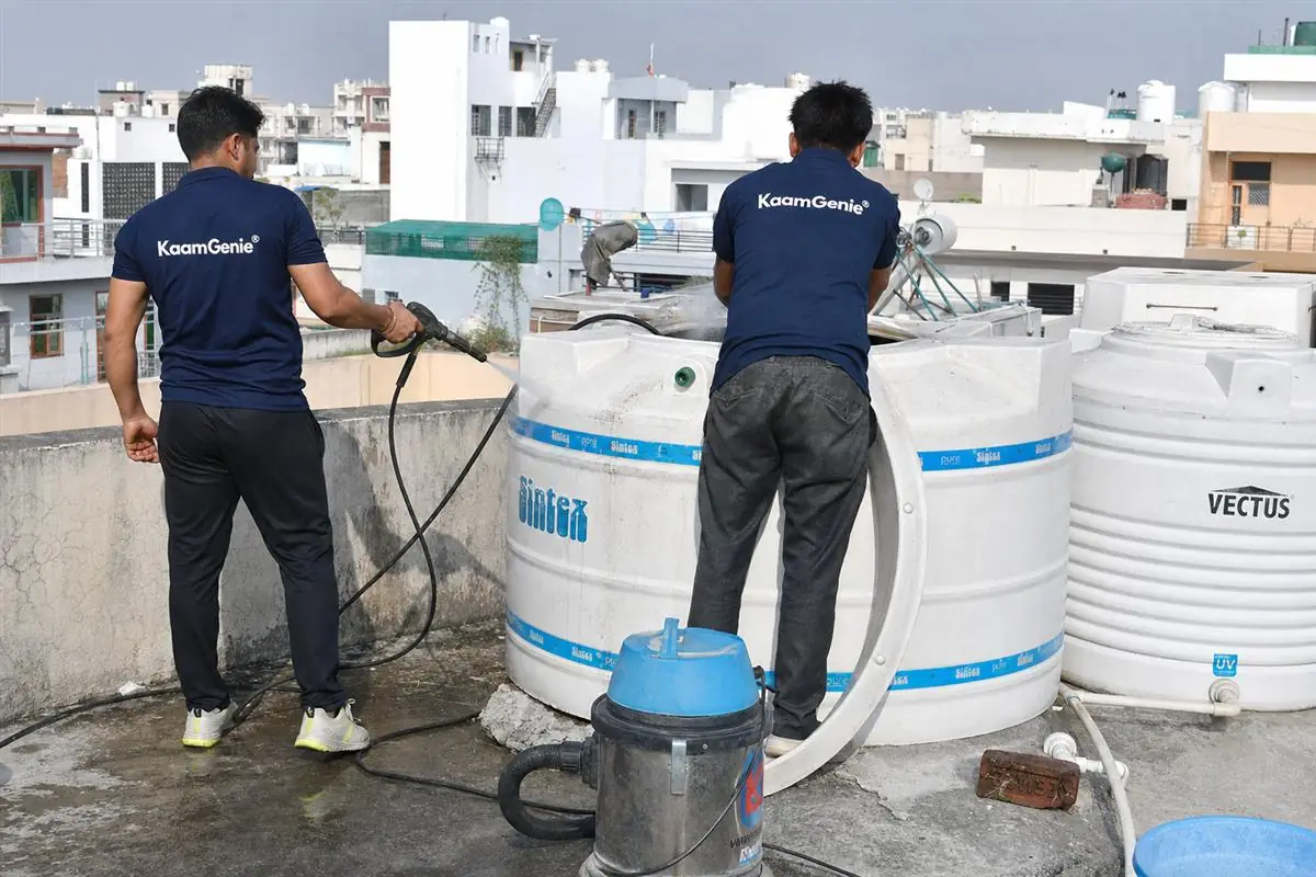KaamGenie crew cleaning a water tank in Sector 11, Faridabad