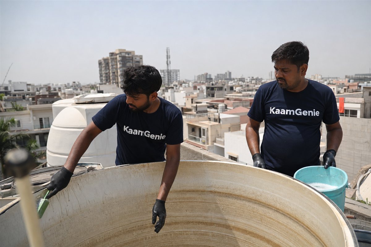 KaamGenie crew cleaning a water tank in Sector 16, Faridabad