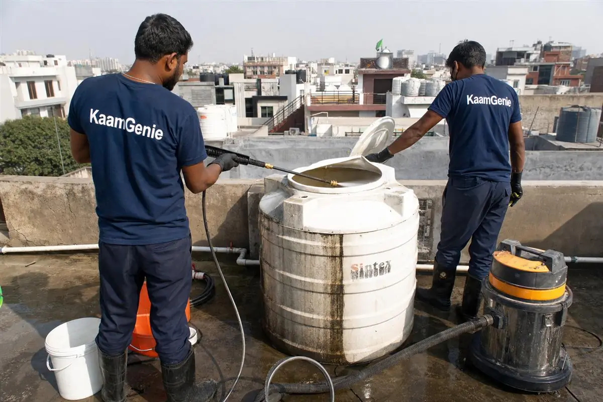 KaamGenie crew cleaning a water tank in Sector 18, Faridabad