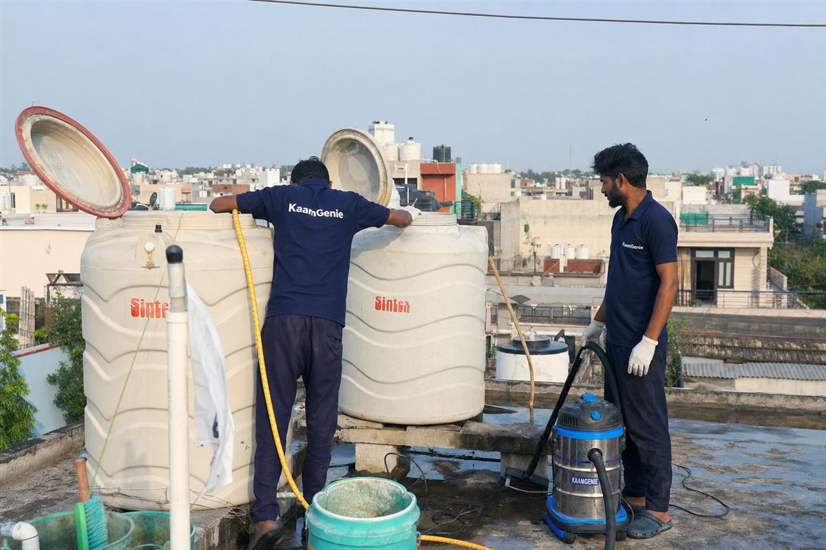 KaamGenie crew cleaning a water tank in Sector 19, Faridabad