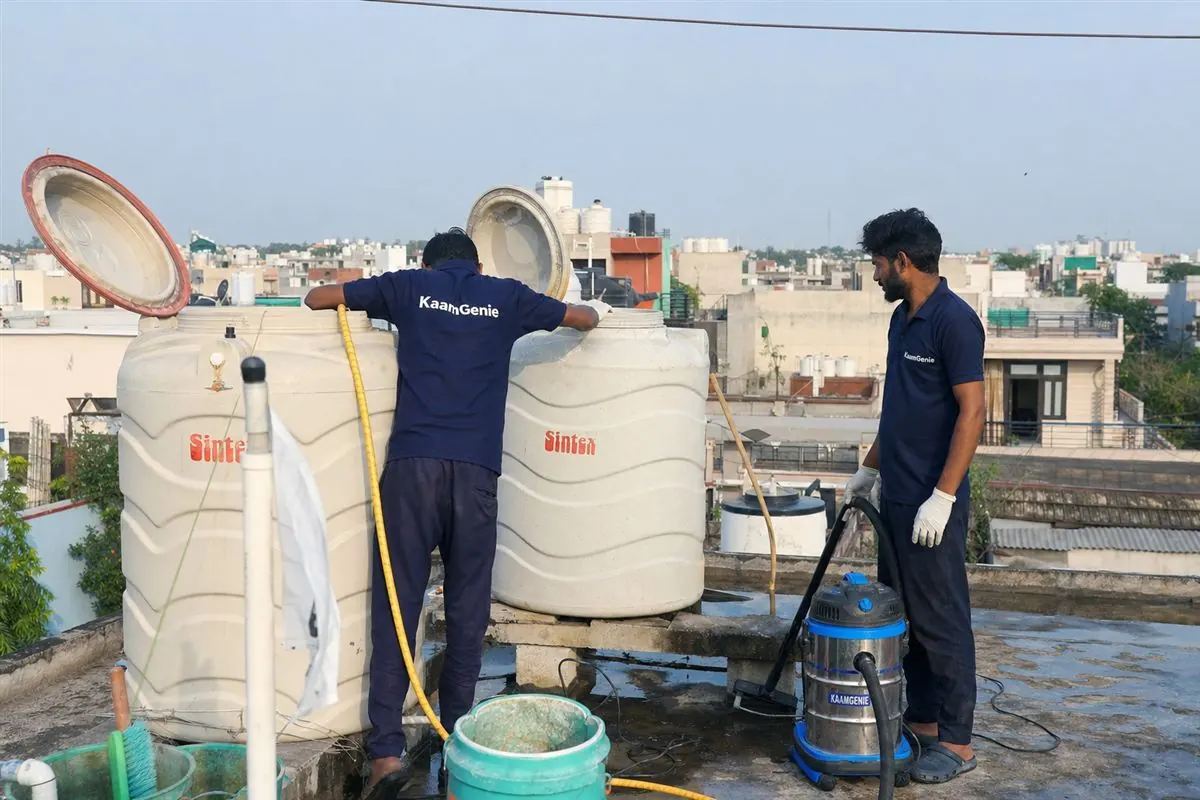 KaamGenie crew cleaning a water tank in Sector 19, Faridabad