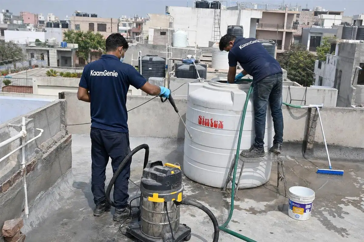 KaamGenie crew cleaning a water tank in Sector 22, Faridabad