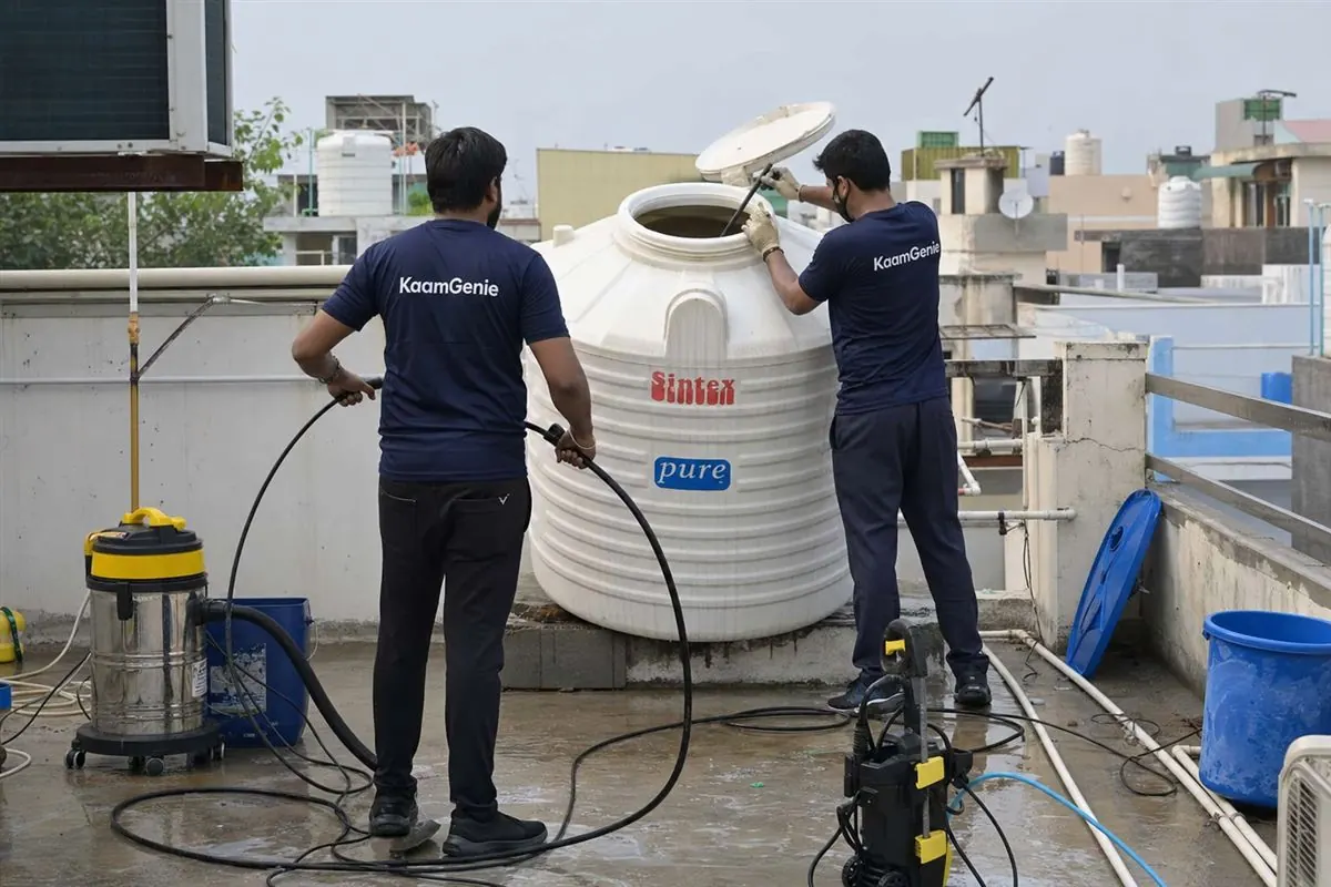 KaamGenie crew cleaning a water tank in Sector 23, Faridabad