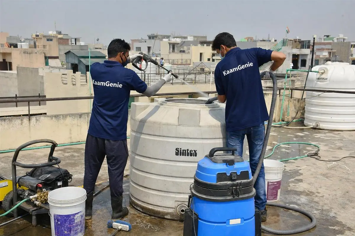 KaamGenie crew cleaning a water tank in Sector 29, Faridabad