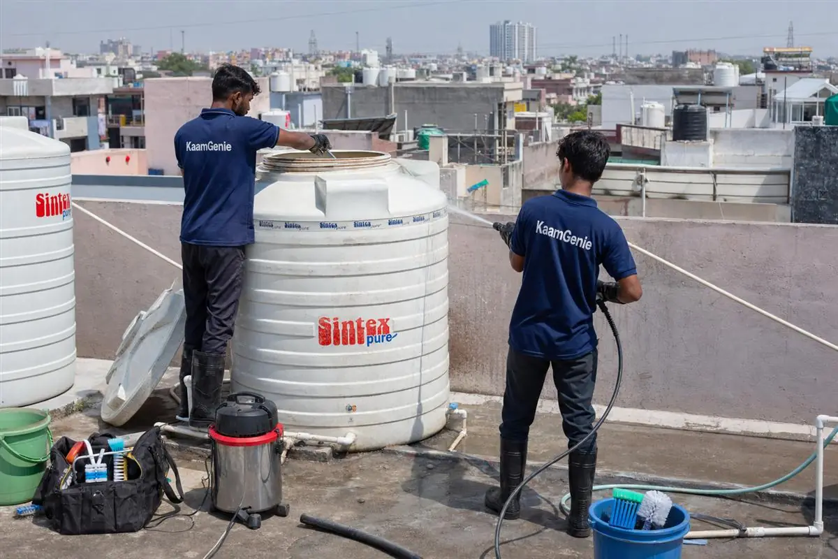 KaamGenie crew cleaning a water tank in Sector 34, Faridabad