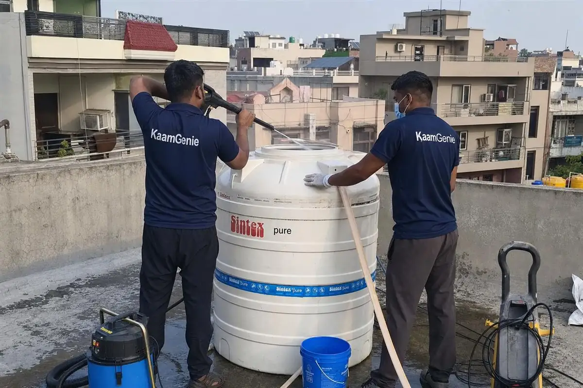 KaamGenie crew cleaning a water tank in Sector 35, Faridabad