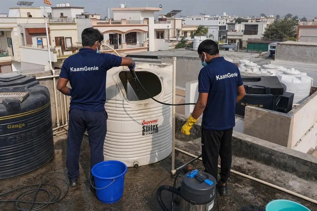 KaamGenie crew cleaning a water tank in Sector 39, Faridabad
