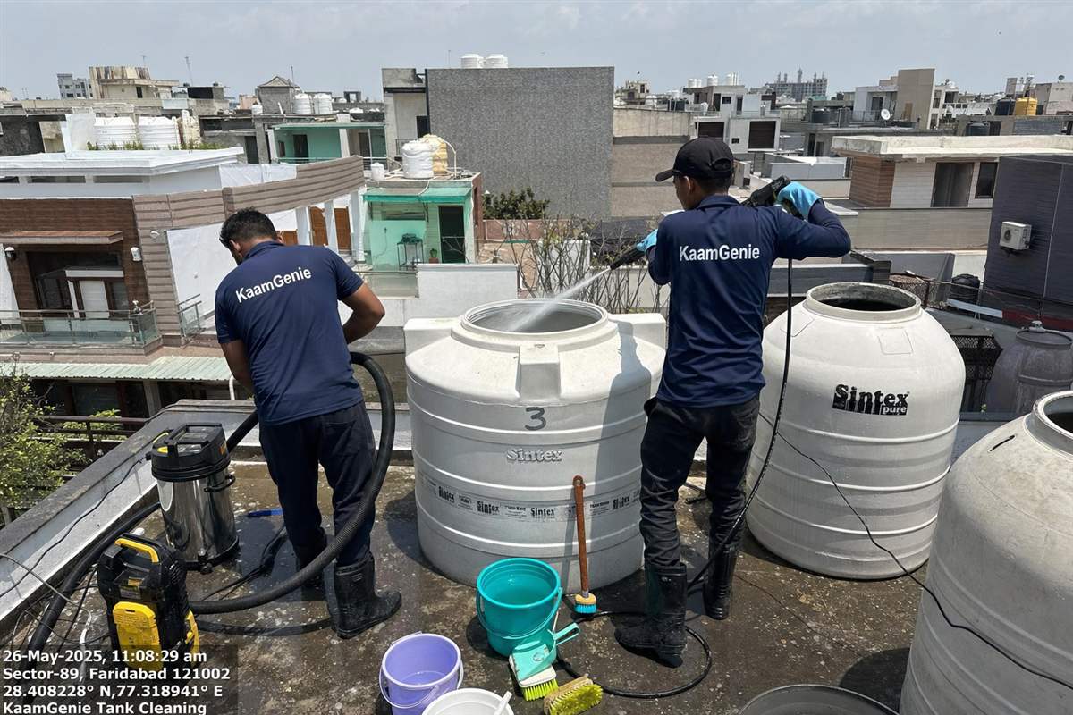 KaamGenie crew cleaning a water tank in Sector 46, Faridabad