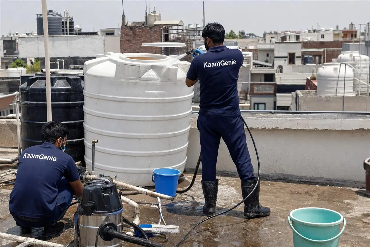 KaamGenie crew cleaning a water tank in Sector 7, Faridabad
