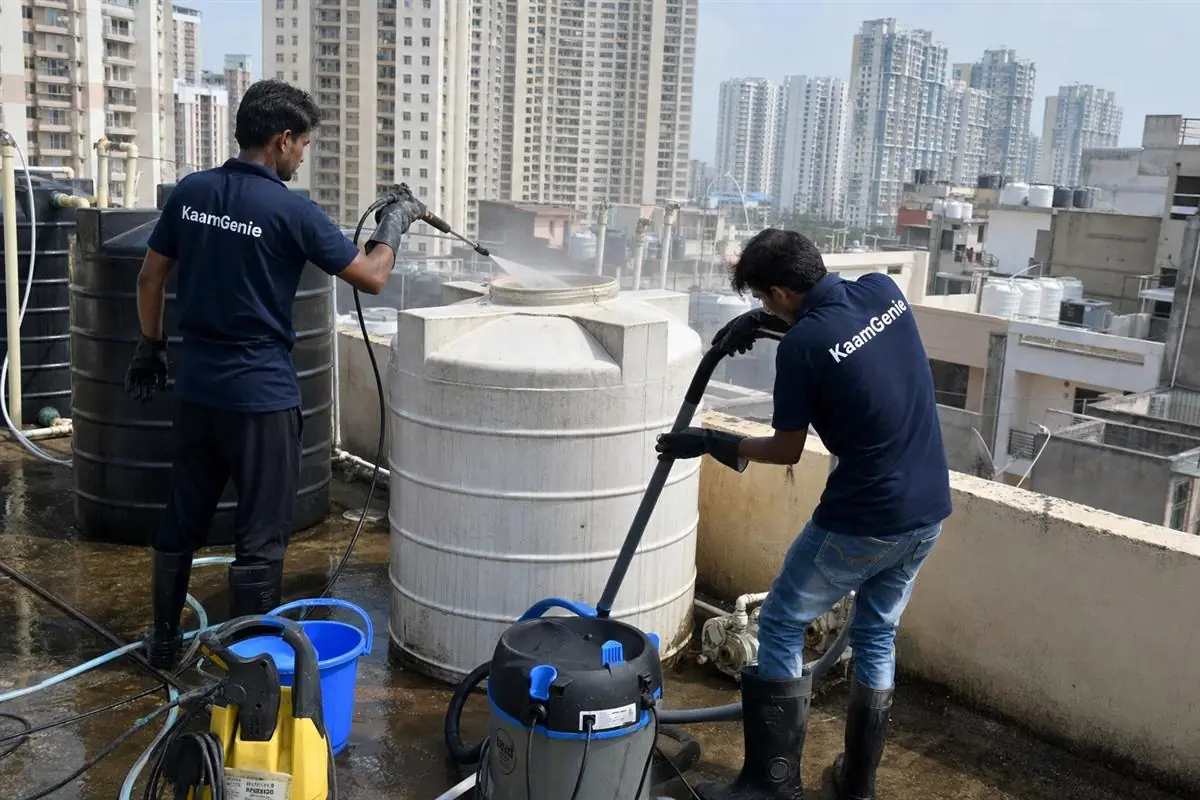 KaamGenie crew cleaning a water tank in Sector 76, Faridabad