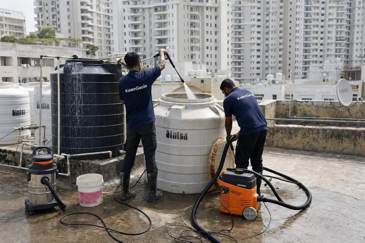 KaamGenie crew cleaning a water tank in Sector 79, Faridabad