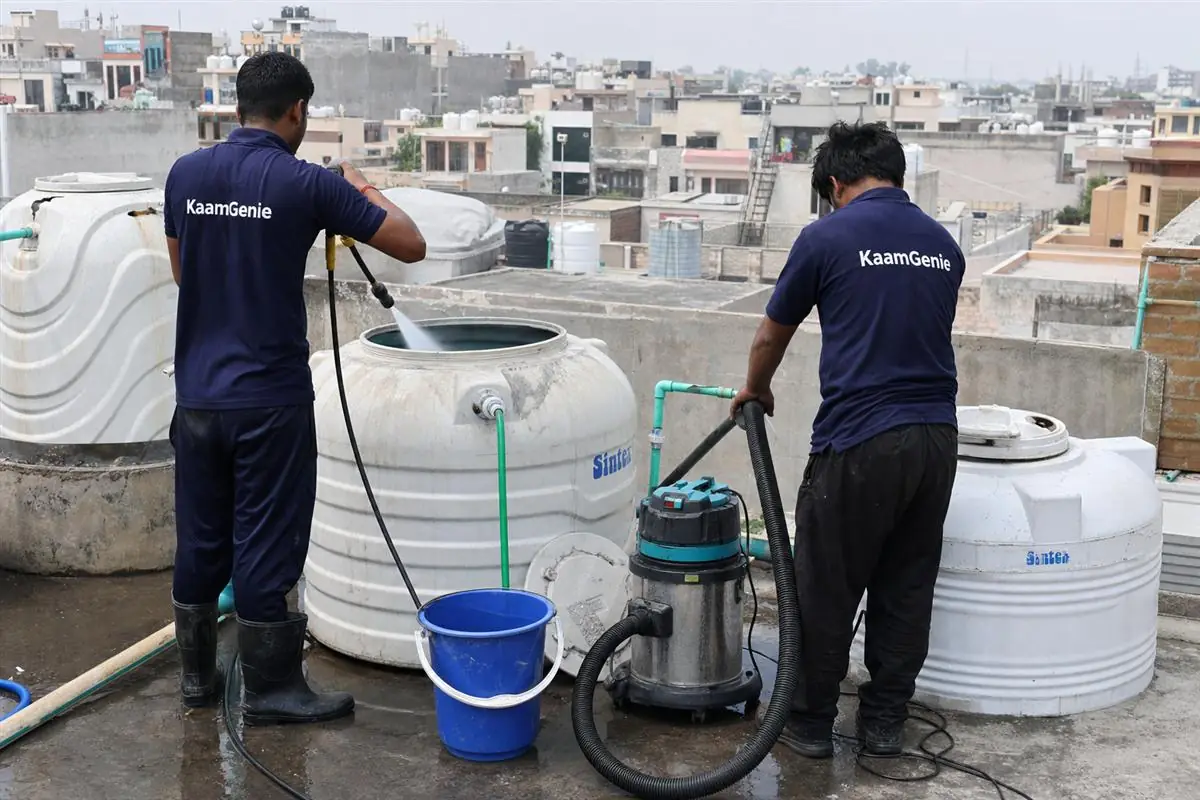 KaamGenie crew cleaning a water tank in Sector 8, Faridabad
