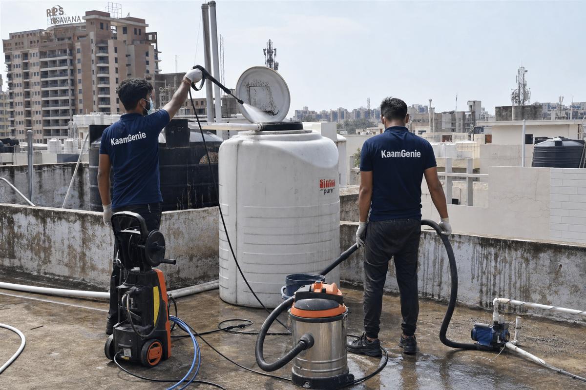 KaamGenie crew cleaning a water tank in Sector 83, Faridabad