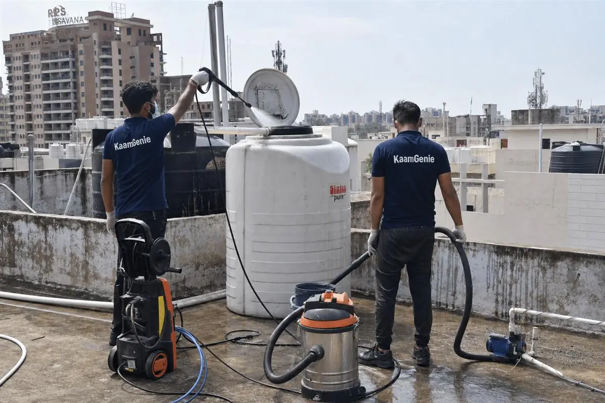 KaamGenie crew cleaning a water tank in Sector 83, Faridabad